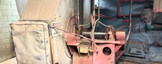 On-site fan service setup showing blower housing, drive components, and service connections